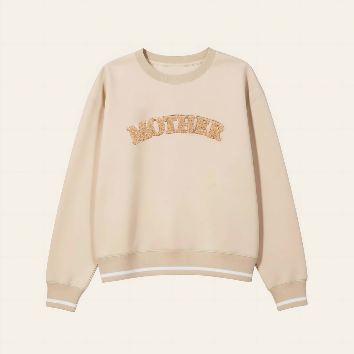 Beige sweatshirt with 'MOTHER' text on a beige background